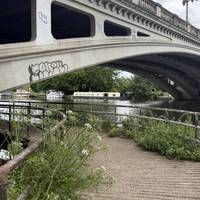 Head to the bridge and take a right to pass under and then up the steps. The concrete bridge was built in 1923.