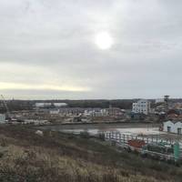 To the right of you, there is the remains of coastal industry in the form of old warehouses and factory buildings. Beautiful in its own way.