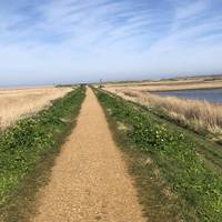 Turn left and head for the beach. Enjoy views of the reserve to your left and Salthouse Marshes to your right.