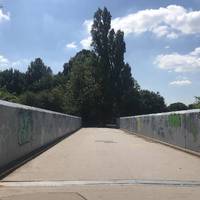 At this road bridge, cross over to officially start section 2 of the Capital Ring. At the park entrance walk straight on to follow the path.