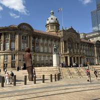You are in Victoria Square. Check out the huge Anthony Gormley statue called Iron:Man (also the name of a Black Sabbath song).