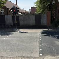 Cross Station Rd at the pedestrian crossing and turn left.