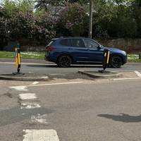 Cross Maidenhead Road via the traffic island.