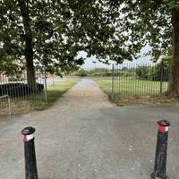Head past the bus stop and through the bollards to enter Filwood Park on the wide tarmac path.
