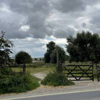 Cross the road when safe to do so. Go through the gap in the wooden fence by the gate, signposted as a bridleway to Silbury Hill.
