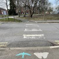 Cross East Castle Street via the zebra crossing with drop kerbs.