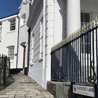 Pass the white building and take a right onto Cuckoo Lane, one of the oldest streets in the city. Wealthy merchants lived here in the 1200s.