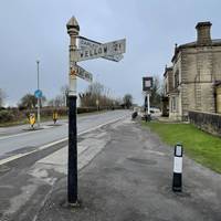 Turn right onto Bath Road and cross it at the traffic island with drop kerbs.