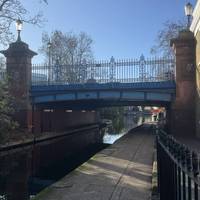 There are steps down to the tow path on Blomfield Rd. Turn right at the bottom and head under the Warwick Avenue bridge pictured here.