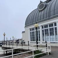 The initial pier’s walkway is flat tarmac and then turns into a wooden broadwalk. Walk through the old toll house kiosks, continue straight.