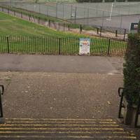 Head into the park and down the stairs (there is also ramp access). Walk past the tennis courts towards the toilets and then turn left.