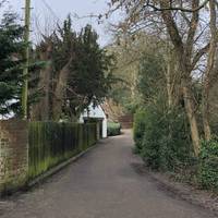 Walk straight ahead and the path will open up by  Lutley Mill House in front of you