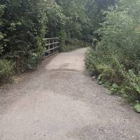 Follow it as it curves and you’ll cross a small bridge.