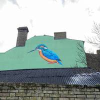 This beautiful piece depicts a Kingfisher. For a closer look continue a little way down Commercial Road.