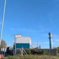 Ready to continue? Head towards the roundabout. Can you see the two blue, rather bizarre-looking pillars?