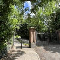 Head onto the pavement, mind the bollards and enter Princes Park.