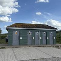 At the far left side of the carpark you can find these public toilets.
