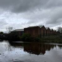 There are many signs of the industrial past and present along the canal. This old brick warehouse now a hardware store.