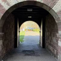 Make your way through the arches into the gardens.