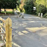 Turn left through a gate just after the second bridge. Walk ahead to the right of the car park and Lido.