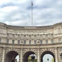 Pass by Trafalgar Square and head towards Admiralty Arch, commissioned by King Edward VII in memory of his mother, Queen Victoria.