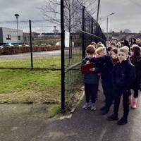Turn right when leaving the School and walk to the end of the School grounds.