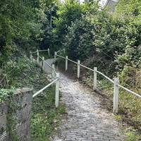 Take the steep cobbled staircase, which is part of the Heart of Wales Line Trail.