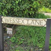 Turn left when you come out of the station onto Wessex Lane. You'll see Bluestar bus stop and a pub in the distance.