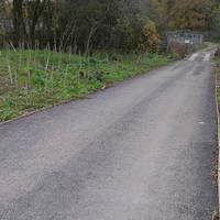 On reaching a wide track, initially with a tarmac surface, turn right along it, soon crossing a stream.