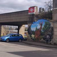 As you leave Tolworth station, take a right at the mural and walk along the road
