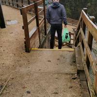 Soon, take the stairs down to the right. There is a useful handrail on the right.