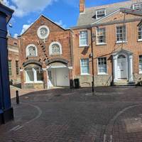 At the High Street T-junction, turn left and enjoy the shops and eateries along the pedestrianised road.