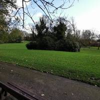 There are great views across the park lawns from a bench along the way. After this, watch out for a few potholes in the path.