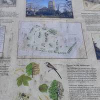 To the left of the church is an interpretation board