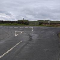 You will soon arrive at the junction of the Military Road, where you need to turn left.  Take care, it's the busiest road on the walk.