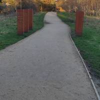 Continue along the path enjoying the artworks, wildflower meadow,  pond and woodland