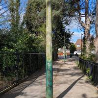 Continue straight ahead with the Nottingham University Campus on your right.