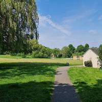 Enjoy the open spaces and play features of this park opposite the museum. Exit on the bottom side, after the sand pit. Turn right