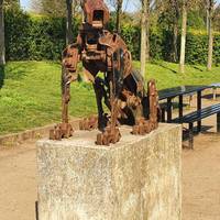 Before you head off, don't miss this dog sculpture on the other side of the entrance from the car park.