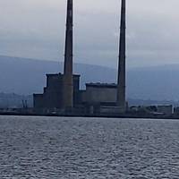 Dublin port is visible across the water with the Wicklow mountains in the distance.