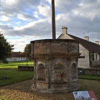 Cross a side street and then pass Preston Market Cross, which was erected in 1617 to serve the town.