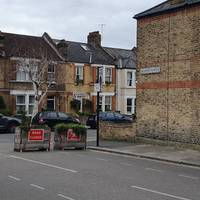 Trace back to the exit you just passed that comes out onto Manor Park Road. Turn right towards Manor Lane Terrace, walk through the barriers