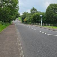 Turn left onto Glenafeoch Road. Cross the road once you get to the traffic island just after the 20 speed signs.