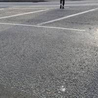 At the roundabout, bear left towards Asda (with accessible parking) but almost immediately cross the road via the tactile dropped kerbs.