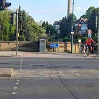 With your back to the gatehouse use the pedestrian crossing to cross the road.