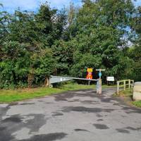 Walk down the path just before the visitor centre to the sign post and information board.