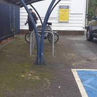 It  has a small car park and covered cycle parking.