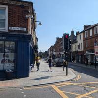 Cross at the lights and pass St. Peter's Street as you make your way down the High Street towards Bedford Town centre.