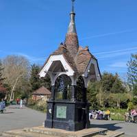 A beautiful fountain sits ahead. Pause to take it in, then follow the path to the left to continue your walk.