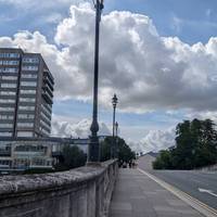 Keep walking across the bridge until you reach it's end.